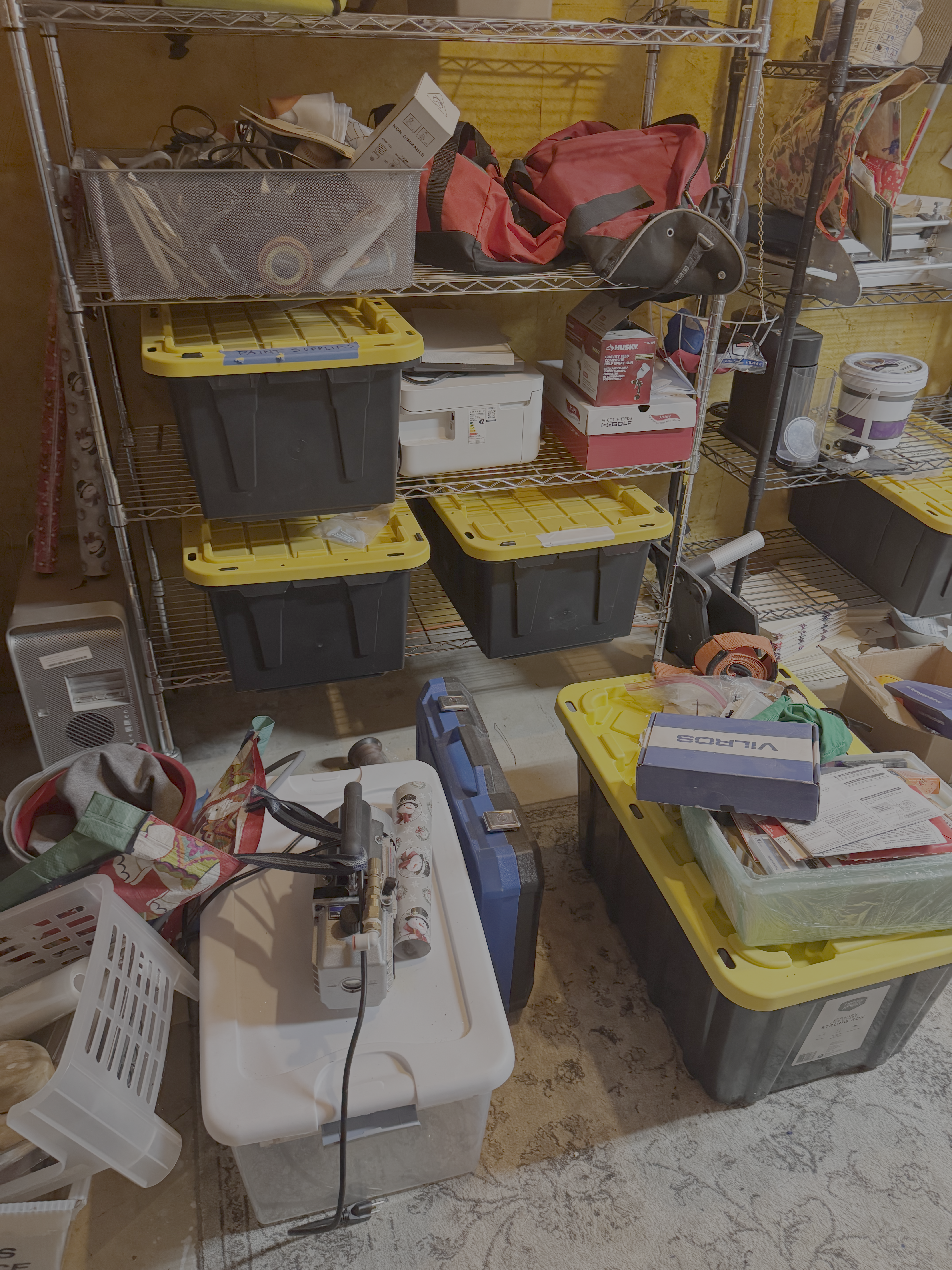A messy basement full of unlabeled bins